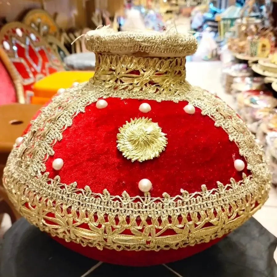 Red and gold decorated matka with pearls