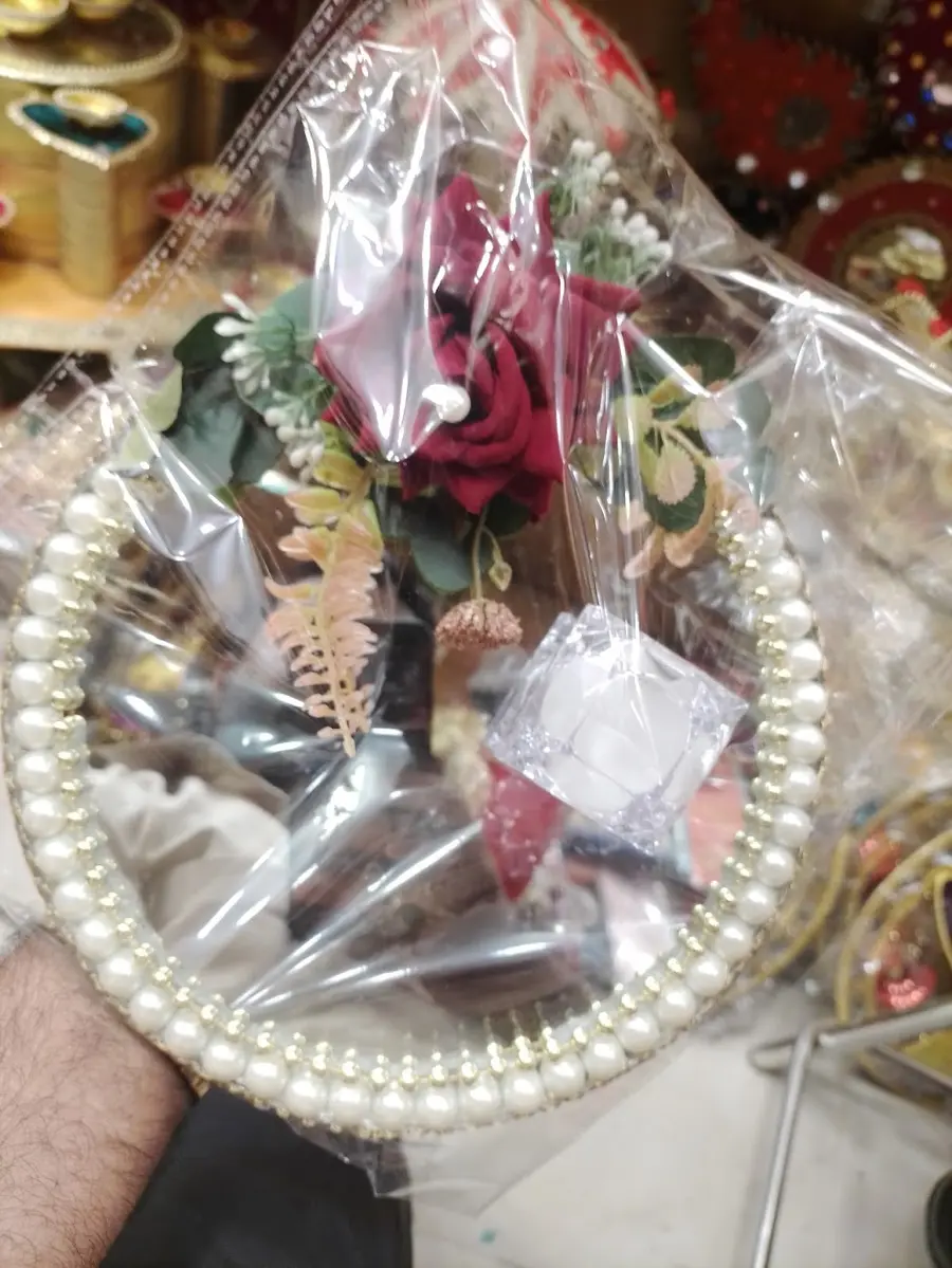 Gift platter wrapped with pearls and flowers