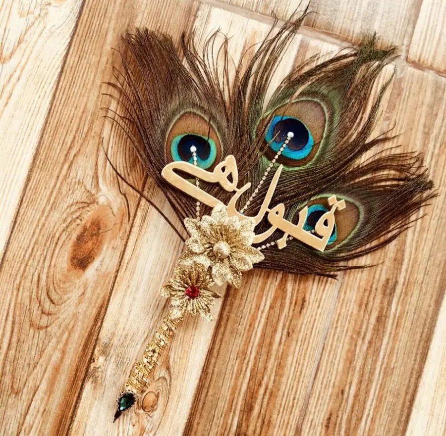 Peacock feather nikah pen with the name in Urdu