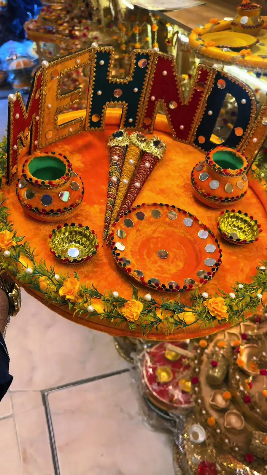 Orange mirror-work mehndi thaal with green katoris